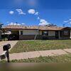 Front view of the home with hail damage.