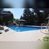 The completed Durastone pool deck enhances the homeowner's outdoor space, making it both stylish and functional for family and guests.