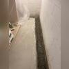 A shallow trench was created around the interior perimeter to make space for the WaterGuard system.
