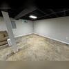 The damp basement before the waterproofing project.