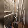 The old, worn, and broken sump system in the basement.