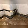 Here you can see where our crew has carved out room in the concrete slab to be able to install the WaterGuard System. You can also see the damaged areas along the bottom of the wall, where the water was seeping through.