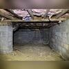 This crawl space in Pittsboro, NC shows clear signs of moisture damage and poor insulation. The dirt floor, exposed block walls, and falling insulation create an environment that allows humidity, pests, and mold to thrive. Over time, these conditions can compromise the foundation and negatively...