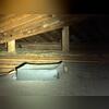 This attic had random debris, trash and dirt spread around. This was decreasing indoor air quality of the home.