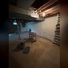 The damp basement before the waterproofing project.