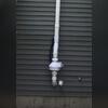RN2 fan positioned for optimal airflow above the sandy soil near the drain.