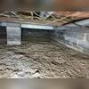 Before the encapsulation project, this crawl space suffered from moisture issues.