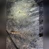 This crawl space vapor barrier is not doing its job. It is covered in mud, dust, and debris.