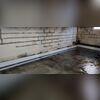 This is what our system looked like before we covered it with a concrete float. We first trenched the floors to make room, and then we drilled weeping holes in the coves to invite water in. We then backfilled the trenches with our WaterGuard subfloor drains and gravel. After we graded the drains...
