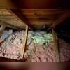 This existing insulation was removed to expose the attic floor and allow a clean surface for sealing and new insulation. This step is essential to eliminate ineffective materials and address hidden air leaks.