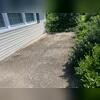 Concrete settlement around this homeowner's front entryway sidewalk was caused by shifting soil beneath the surface, often due to poor compaction, water erosion, or soil drying and shrinking over time. This results in uneven, sunken slabs that can create tripping hazards and curb appeal concerns.