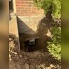 To stop wall cracks due to foundation settling, our team installed helical piers around the perimeter of this home to support the foundation on stable soils deep underground.