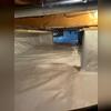 A wide view of the crawl space after encapsulation shows how CleanSpace® creates a bright, clean, and dry environment.