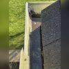 Standing water and granules at the bottom of the gutters signaled roof deterioration.