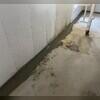 WaterGuard is installed along the perimeter of the basement floor and covered in fresh concrete to provide a seamless finished look. The WaterGuard Port is left visible to provide access to the system when needed.