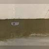WaterGuard is installed along the perimeter of the basement floor and covered in fresh concrete to provide a seamless finished look. The WaterGuard Port is left visible to provide access to the system when needed.