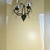 The customer's wall cracked due to foundation settlement, which occurs when the home's foundation shifts or sinks because of unstable soil. This movement creates stress on the structure, causing the walls to shift and drywall to crack as a result.