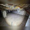 The state of the crawl space before the project.