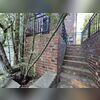 This photo shows visible stair-step cracking along the brick wall and separation near the exterior steps. These are classic signs of foundation settlement, often caused by shifting soils and poor water drainage around the property. Left unaddressed, these cracks can widen over time, leading to...