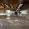 Our SilverGlo insulation panels were wrapped against the concrete walls. They are made of graphite, (like newer pencils are) and they won't ever hold moisture. The silver insulation will keep the floors of this home warm in the winter, and they will also help the vapor barrier with keeping moisture...