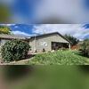 The exterior of the Canon City, CO home with a sub-membrane depressurization system.