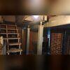 This photo gives a better look at our SmartJack system. We installed these all across the basement to help stabilize the weakest points in the floors above.