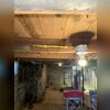 Water intrusion was severely impacting this Silvis basement, as evident in the damp, compromised state shown here. High moisture levels not only limited the usable space but also posed a risk for mold development.