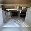 This crawl space was taking on moisture, but our team installed a full encapsulation system to seal, protect, and create a cleaner, healthier environment beneath the home.
