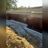 To manage groundwater efficiently, we installed two Zoeller N161 High Volume Sump Pumps and two 24-inch culvert pipes, with 2&frac12;-inch connecting pipes running to the stormwater drains.