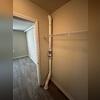 The radon vent pipe was strategically installed through the bedroom closet, keeping the system discreet while maintaining full functionality.