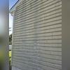 The siding on this home was covered in algae and mildew.