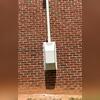 A powerful radon fan with a protective cover was mounted outside to ensure efficient radon ventilation and long-term system durability.