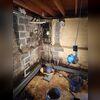 Preparing the sump pump system to manage water captured by WaterGuard. WaterGuard captures water along the floor, protecting the home from future floods.