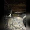 Crawl space during initial inspection. Dust, debris, and mud are visible.