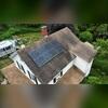 Here's a look at Joe's roof before the replacement. You can see dark streaks of algae growth and moss building up beneath the solar panels. These were clear signs it was time for an upgrade. Click through to see the stunning transformation!