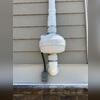 A high-performance radon fan was mounted outside the home to maintain consistent airflow and effectively pull radon gas from the sub-slab area.