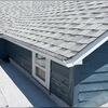 New seamless gutters installed in white, built to last with heavy-duty aluminum and a 20-year paint finish warranty.
