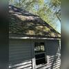 Here's a look at Karen's old roof before the replacement. Heavy moss buildup had taken over, holding in moisture and accelerating shingle deterioration. Swipe through to see the stunning transformation!