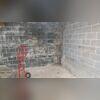 This Boone, NC basement shows early symptoms of water damage and high humidity. The dark staining and efflorescence on the block walls indicate that moisture has been seeping through the porous concrete over time. Without proper drainage or vapor protection, the walls have absorbed water from the...