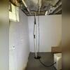 Anne's old sump pump and drainage system could not handle all the water getting into her basement, and she would still find puddles all over the floor.