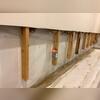Excavation exposes the foundation footer, allowing us to install a complete drainage system.