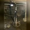 The previously installed sump pump in the crawl space was insufficient to intercept and redirect groundwater before it entered the area, resulting in persistent water intrusion.