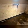 For this basement, the crew installed WaterGuard with a liner extending several inches up the wall to ensure any moisture seepage from the walls is properly drained into the drainage system.