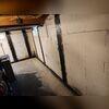 Installed CarbonArmor straps discreetly stabilize walls while maintaining a clean, finished appearance in the basement.