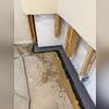 WaterGuard was installed around the perimeter of the basement to direct seeping water from the walls and floors to the sump pump for removal.