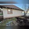 Our crew installed Helical Piers beneath the cabin to permanently stabilize the foundation. These deep steel anchors reach load-bearing soil, lifting and supporting the structure even as conditions near the shore continue to shift.