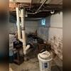 Not only was one wall in Juan's basement beginning to shift and bow, but due to constant water intrusion, the walls and floors were also becoming damaged.