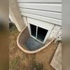 A Rockwell Egress window was installed to provide a code-compliant emergency exit to the basement.