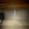 This basement wall showed significant inward bowing and cracking. Our team installed the PowerBrace&trade; system to immediately stabilize the wall and prevent further movement.