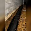 EZ Flow Crawl Space Drainage System is installed to prevent flooding in this dirt crawl space. EZ Flow features a filter fabric with holes on the top and front to accept water from the soil and surface of your crawl space. The pipe also collects water seepage from the crawl space walls and the...
